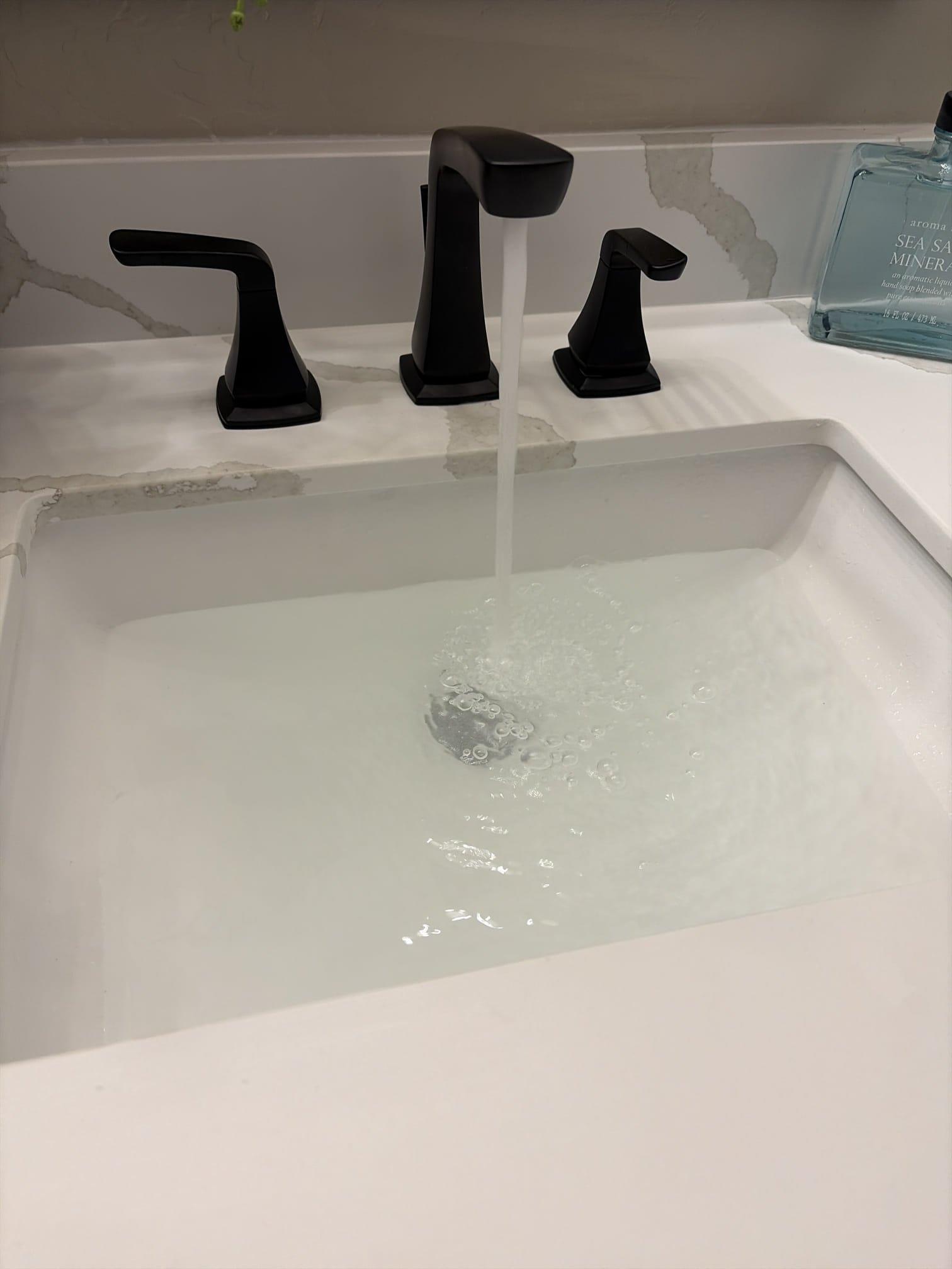 water in sink with clogged drain